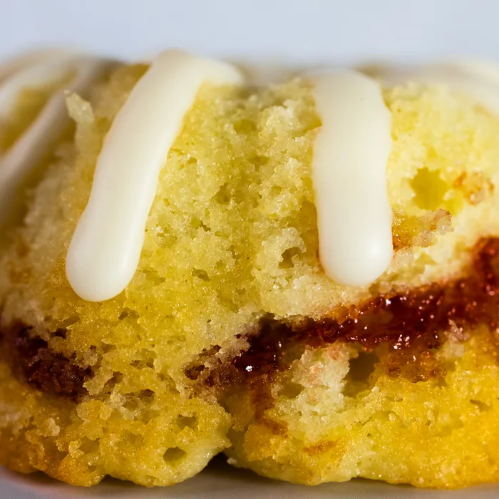 A lemon raspberry bundt cake with raspberry swirled through the crumb.